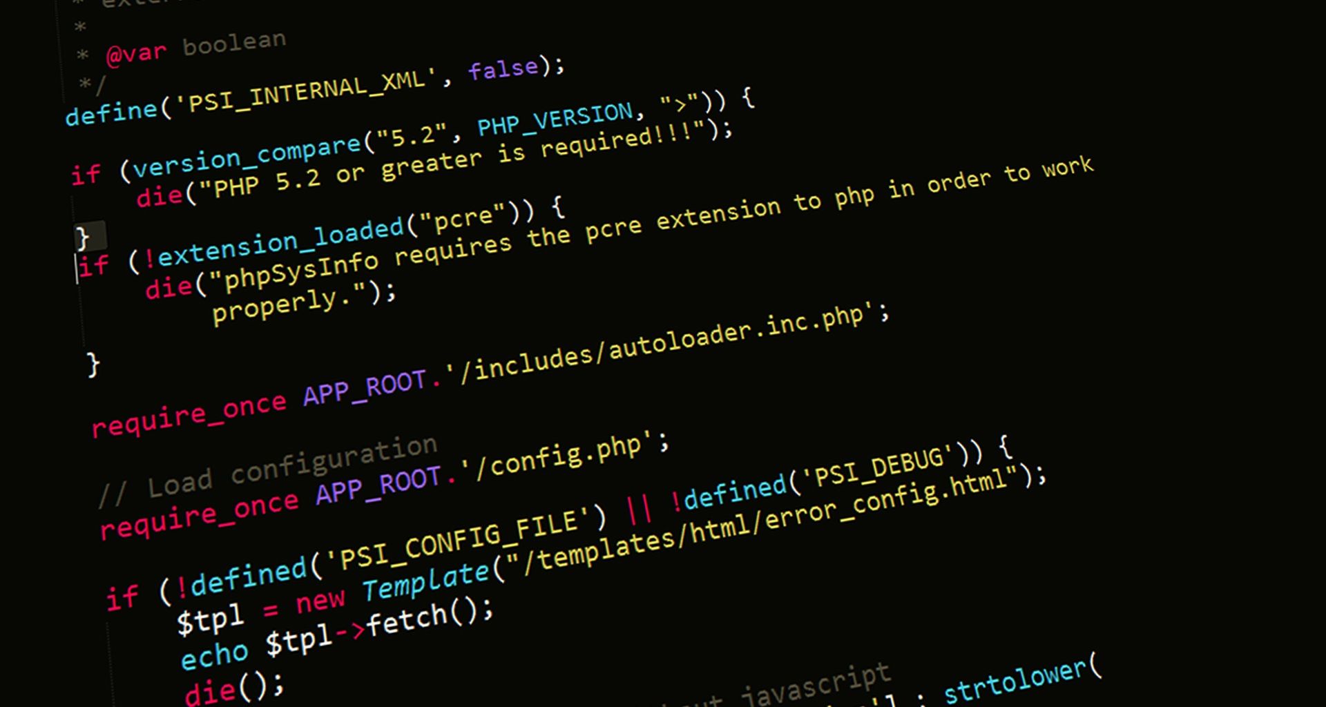 Dark editor showing PHP version checks and autoloader includes
